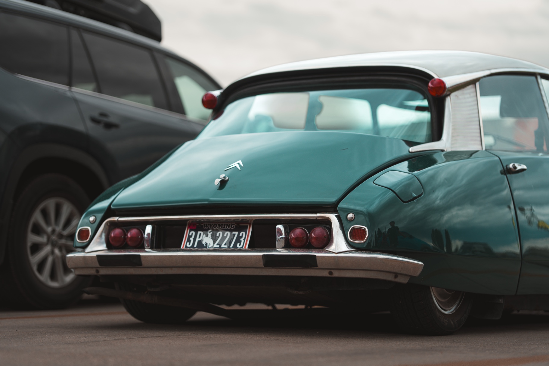 Low rear view of a green Citroen DS with a Wyoming license plate