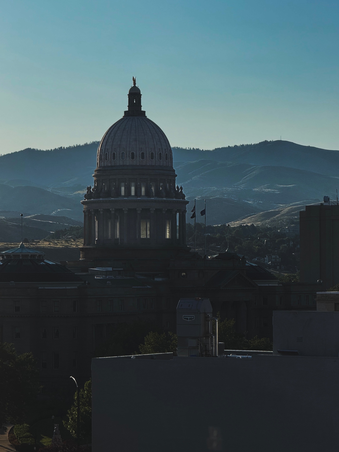 Idaho State Capitol dome backed by the Boise foothills in morning light